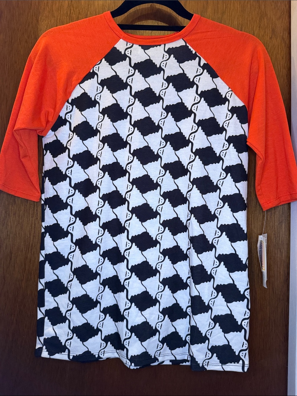 LuLaRoe Orange Raglan Jersey with Black & White Pattern